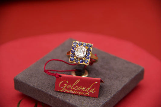 Diamond and sapphire shield ring