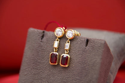 Orecchini pendenti con diamanti e rubini