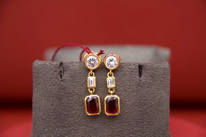 Orecchini pendenti con diamanti e rubini