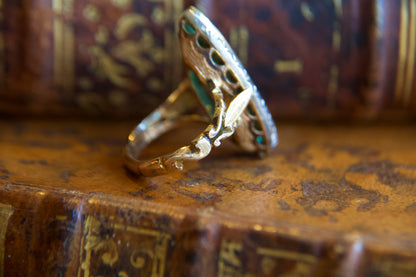 Art Nouveau marquise ring with emeralds