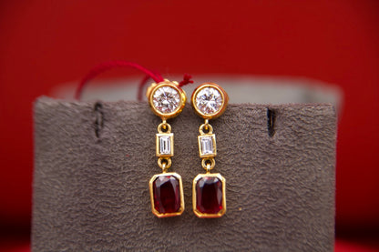 Orecchini pendenti con diamanti e rubini