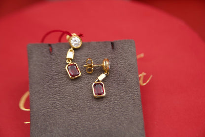 Orecchini pendenti con diamanti e rubini