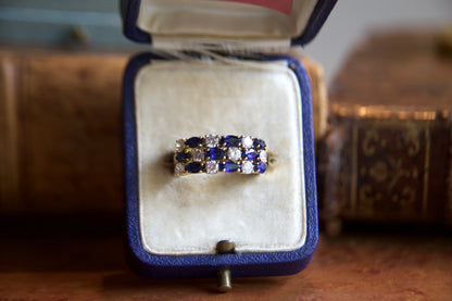 Anello fascia con zaffiri e diamanti
