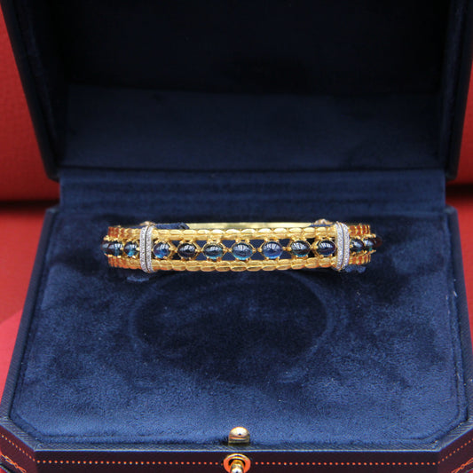 Rigid bracelet with sapphires